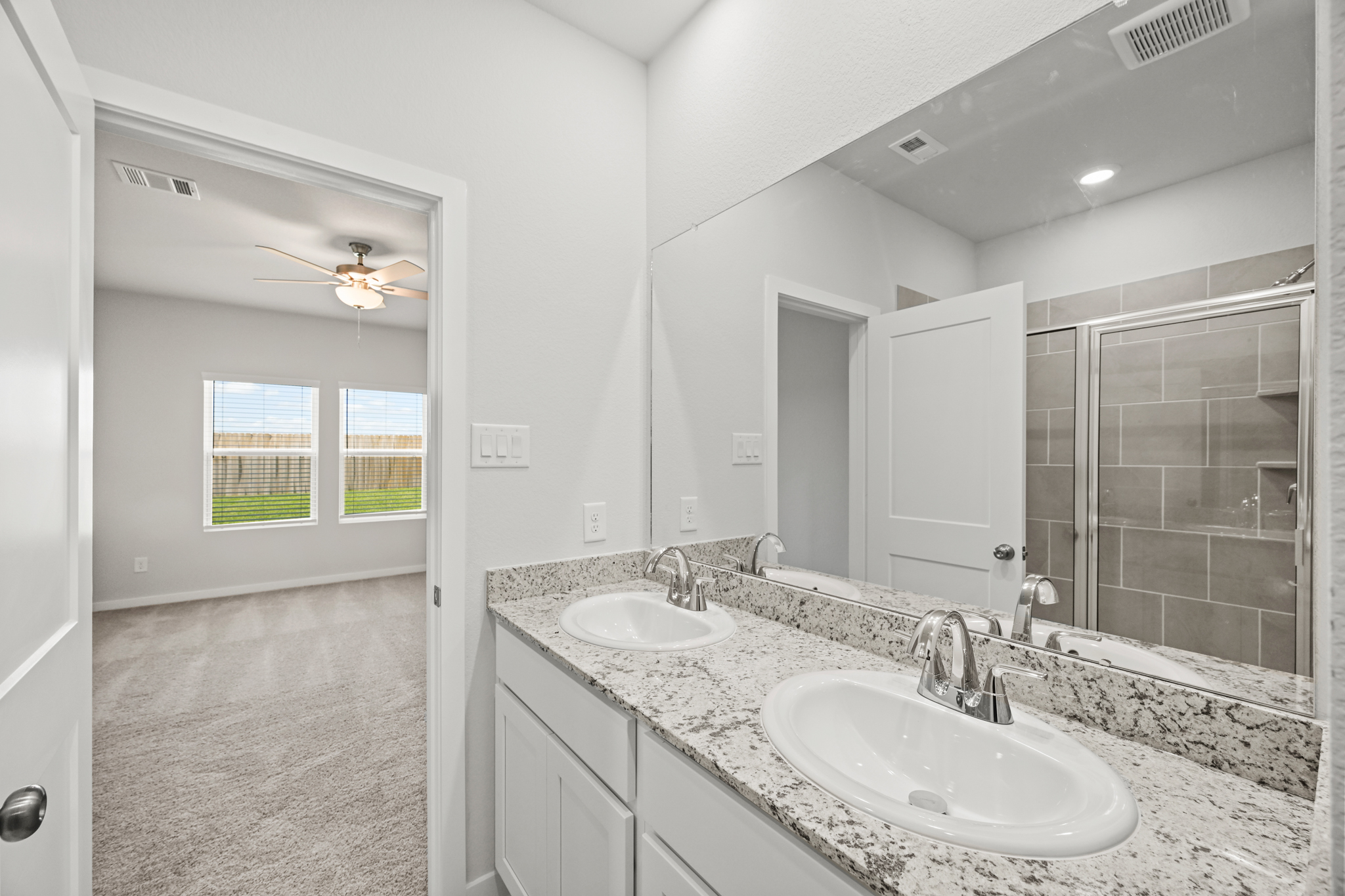 A bathroom with two sinks.