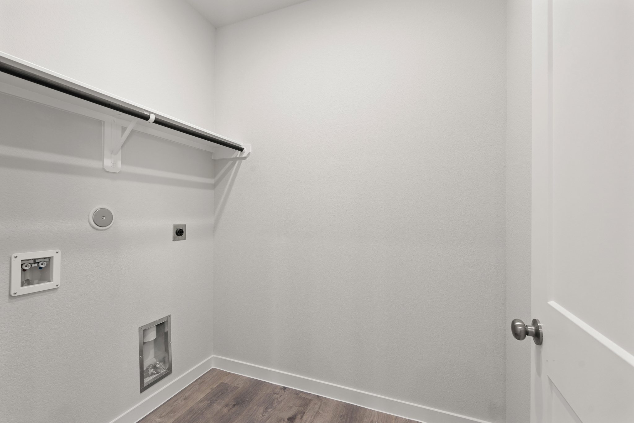 A white wall with a light on it.