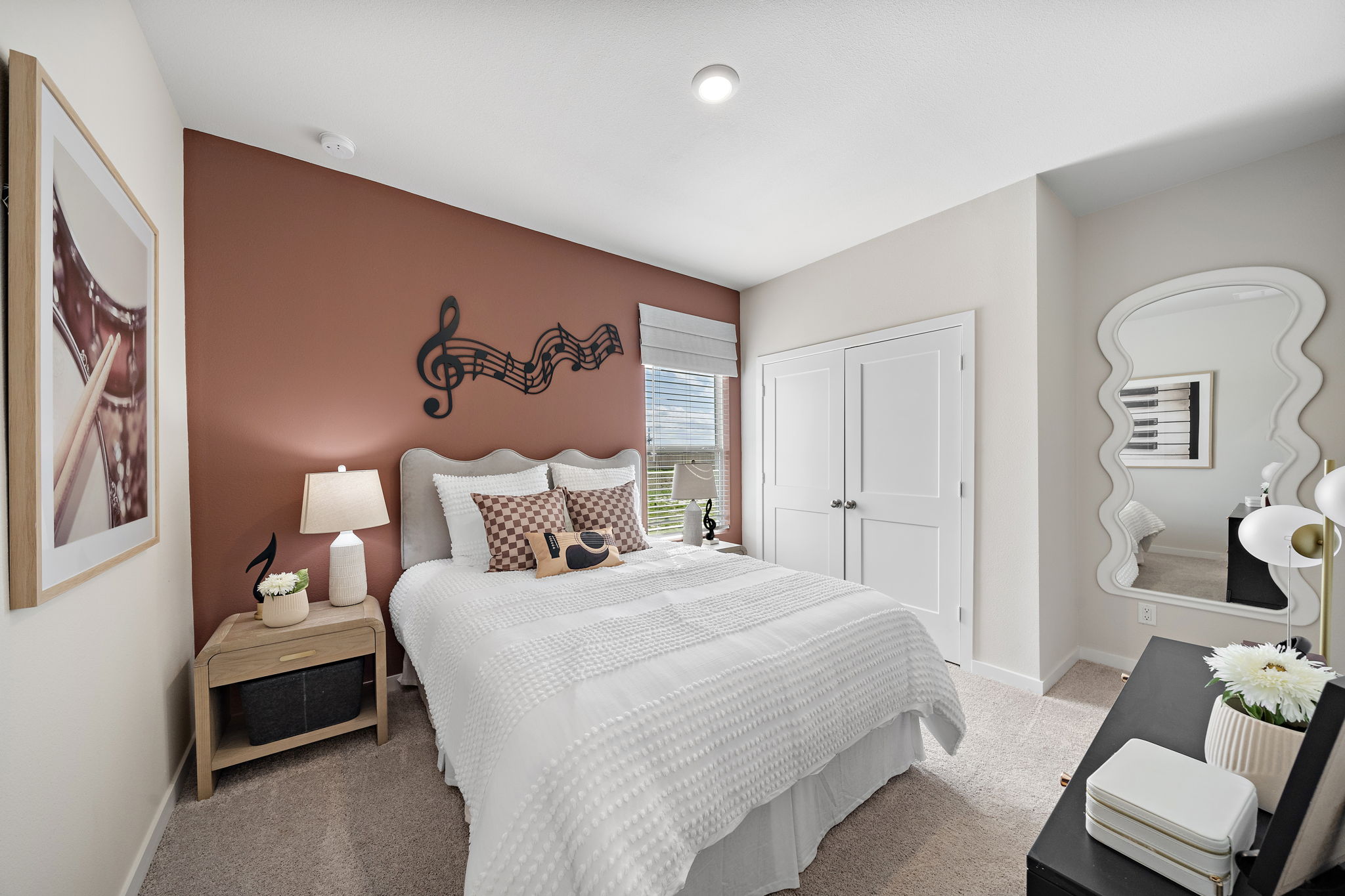 A bedroom with a large bed.