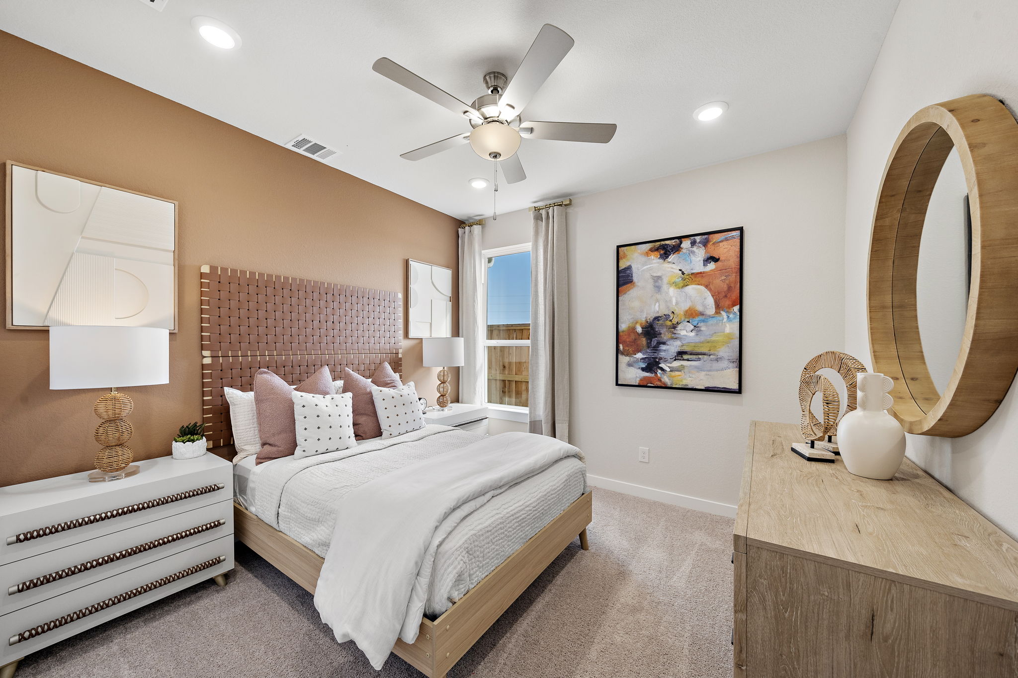 A bedroom with a large bed.