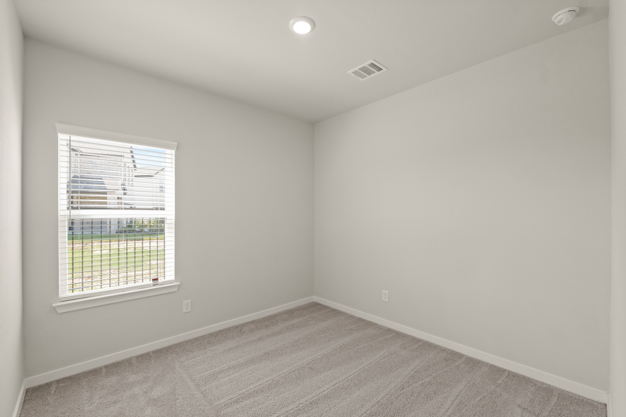 A room with a window and a door.