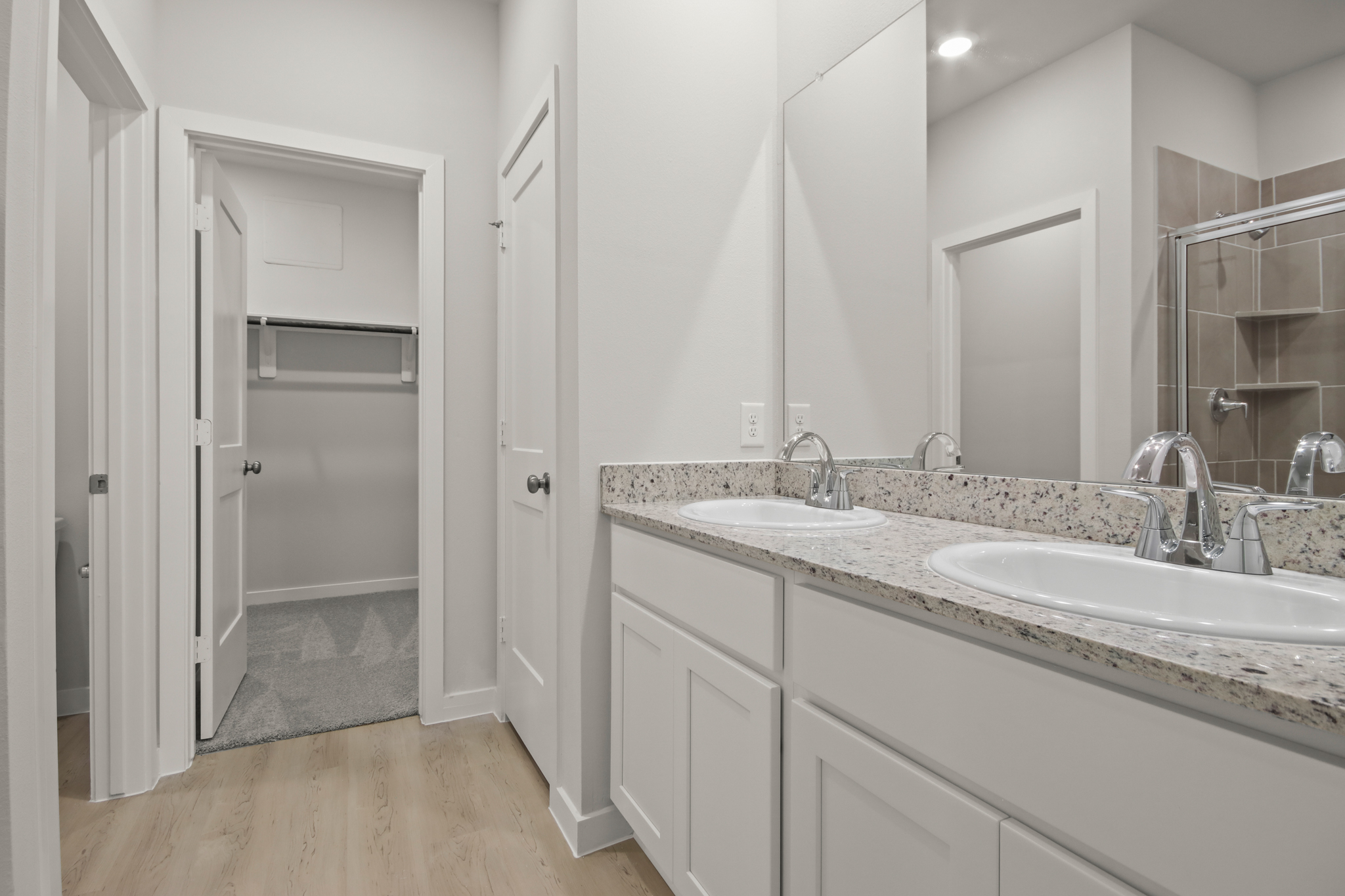 A bathroom with a marble countertop.
