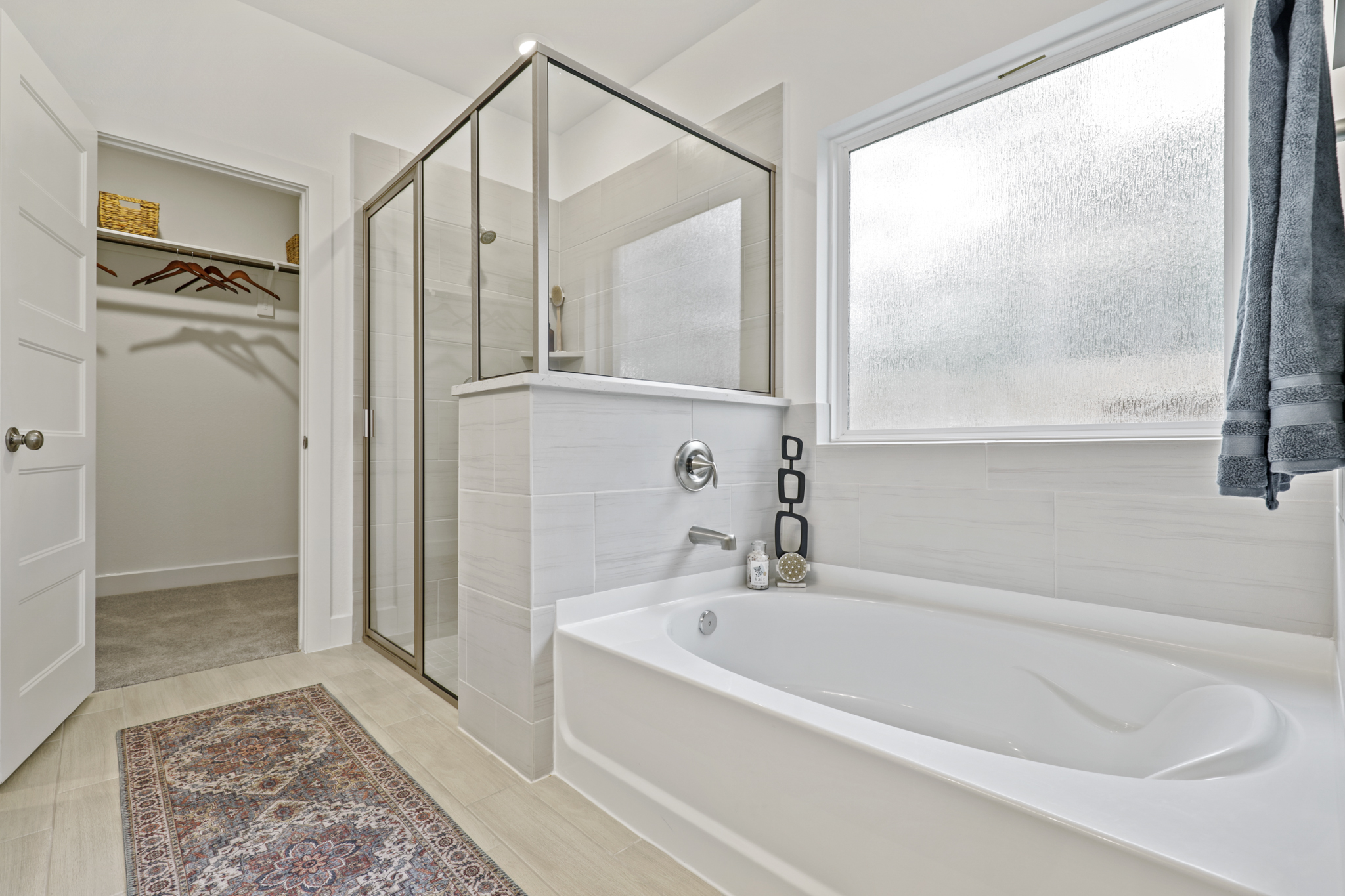 A bathroom with a tub and sink.