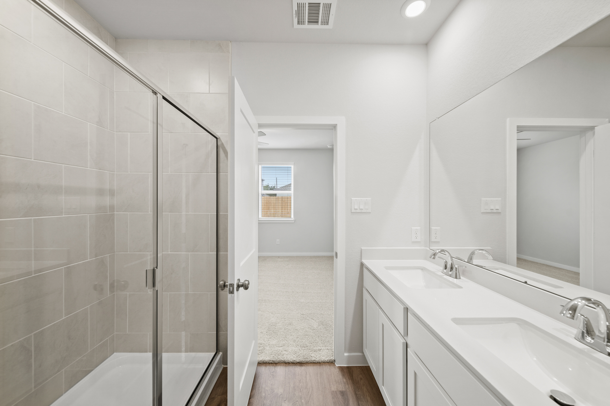 A bathroom with a glass shower.