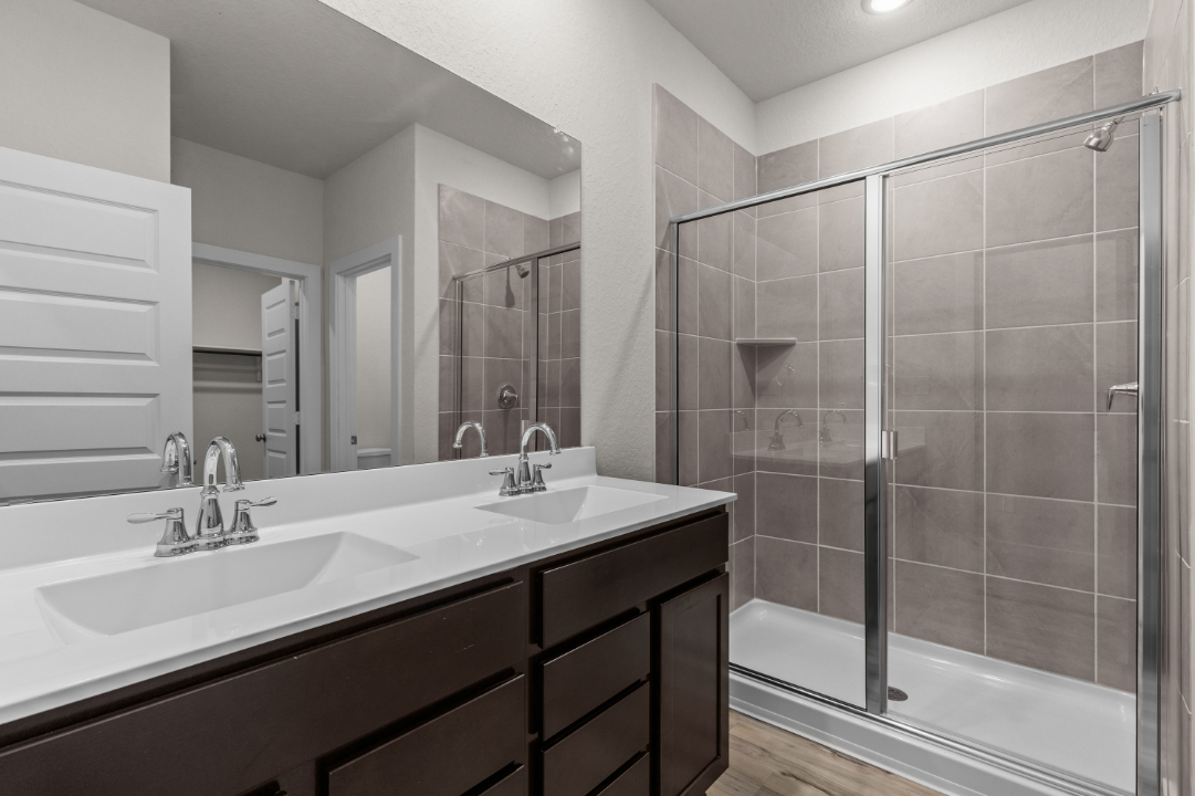 A bathroom with a glass shower.