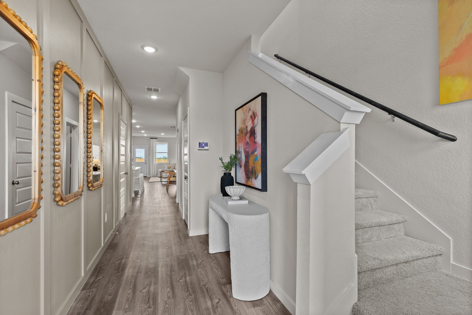 A hallway with white walls.