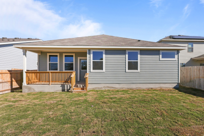 A house with a grass yard.