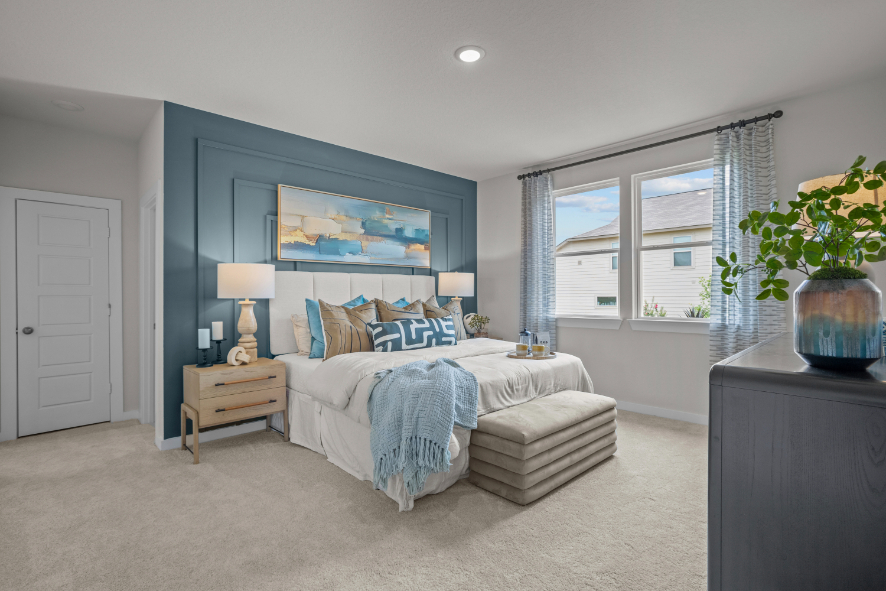 A bedroom with a bed and a couch.