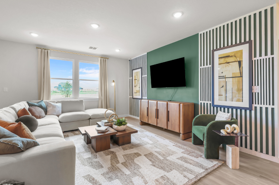 A living room with a tv and couches.