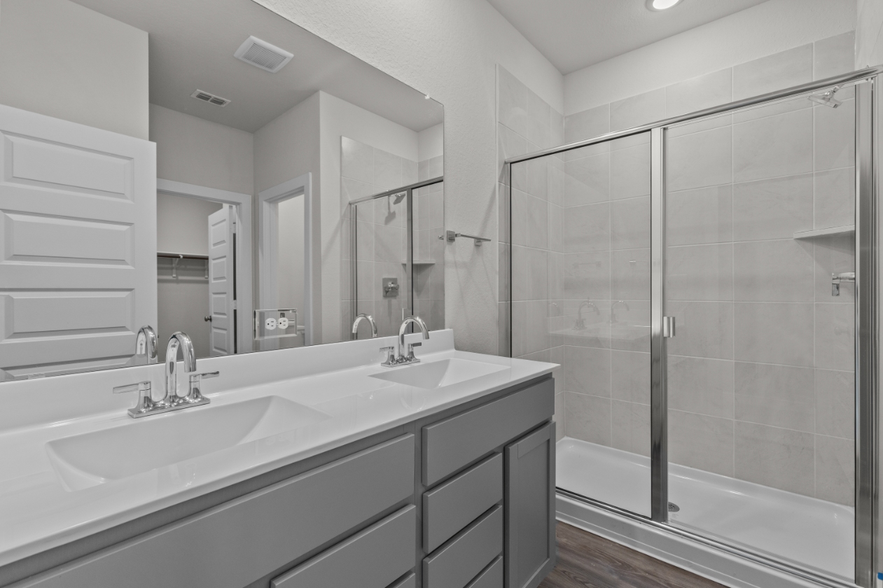 A bathroom with a glass shower.