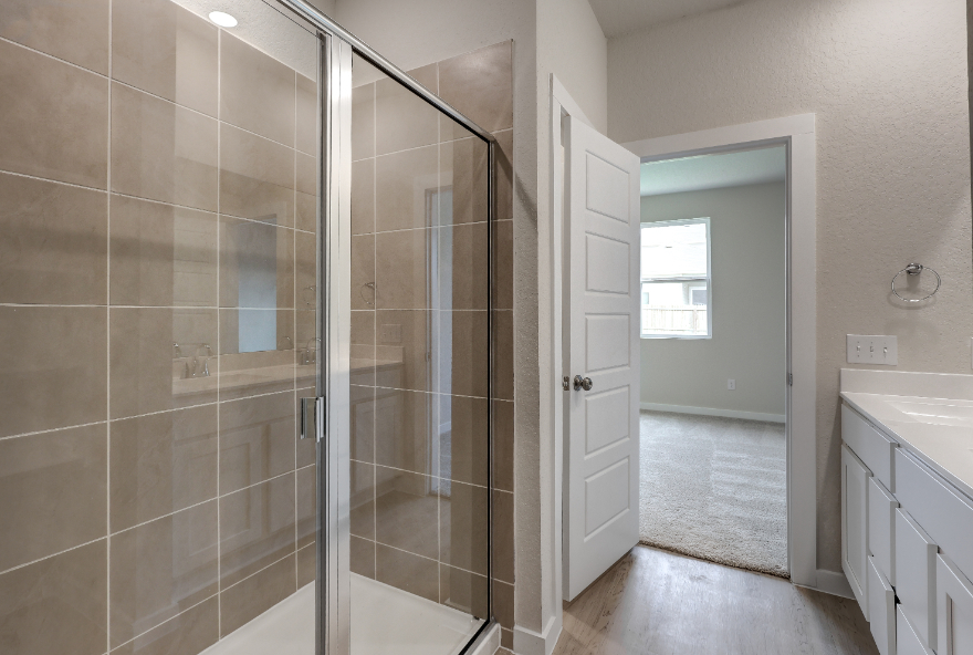 A bathroom with a glass shower.