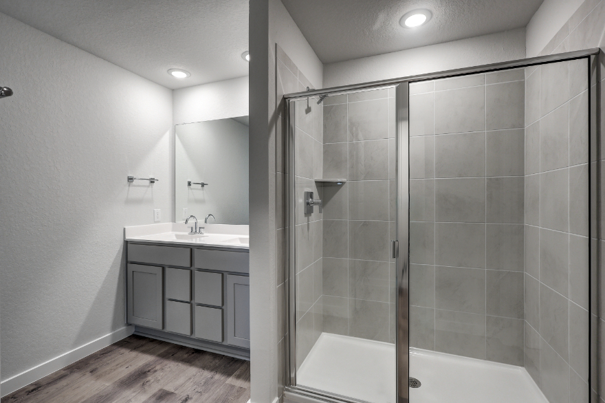 A bathroom with a glass shower.