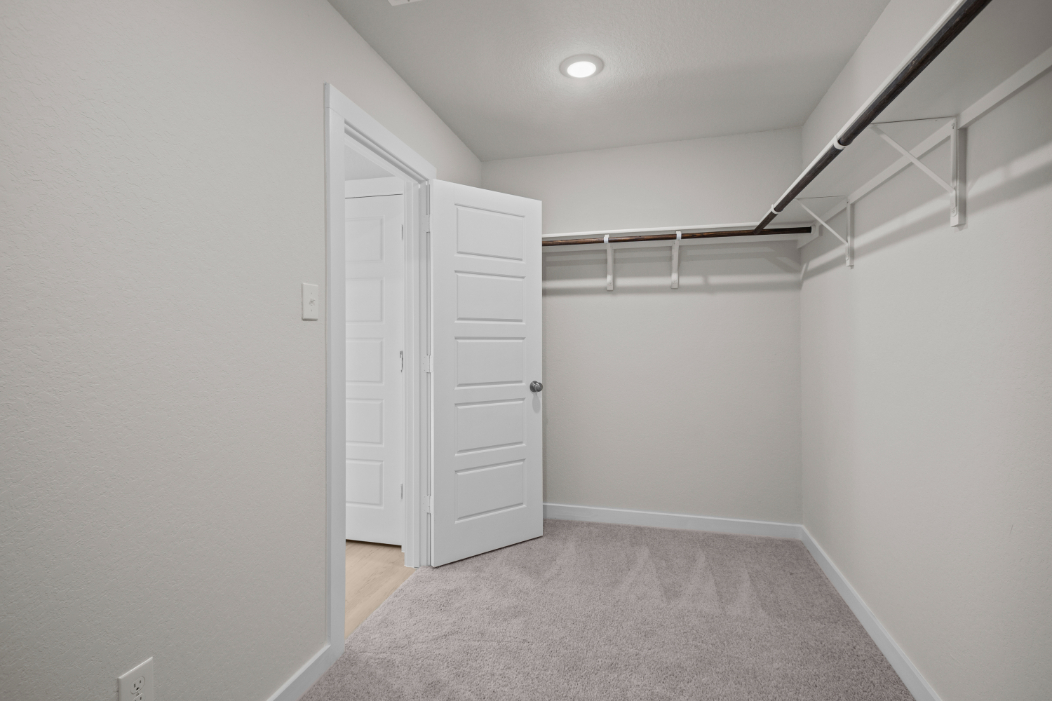 A hallway with white doors.