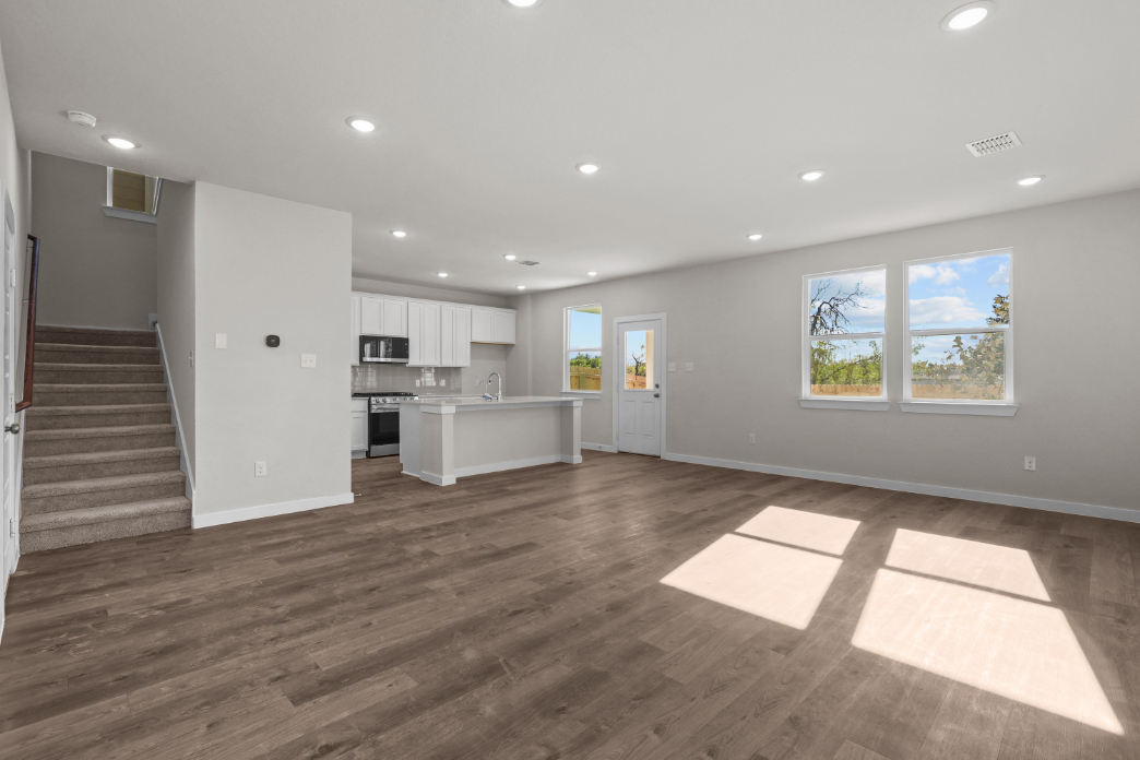A large kitchen with white cabinets.