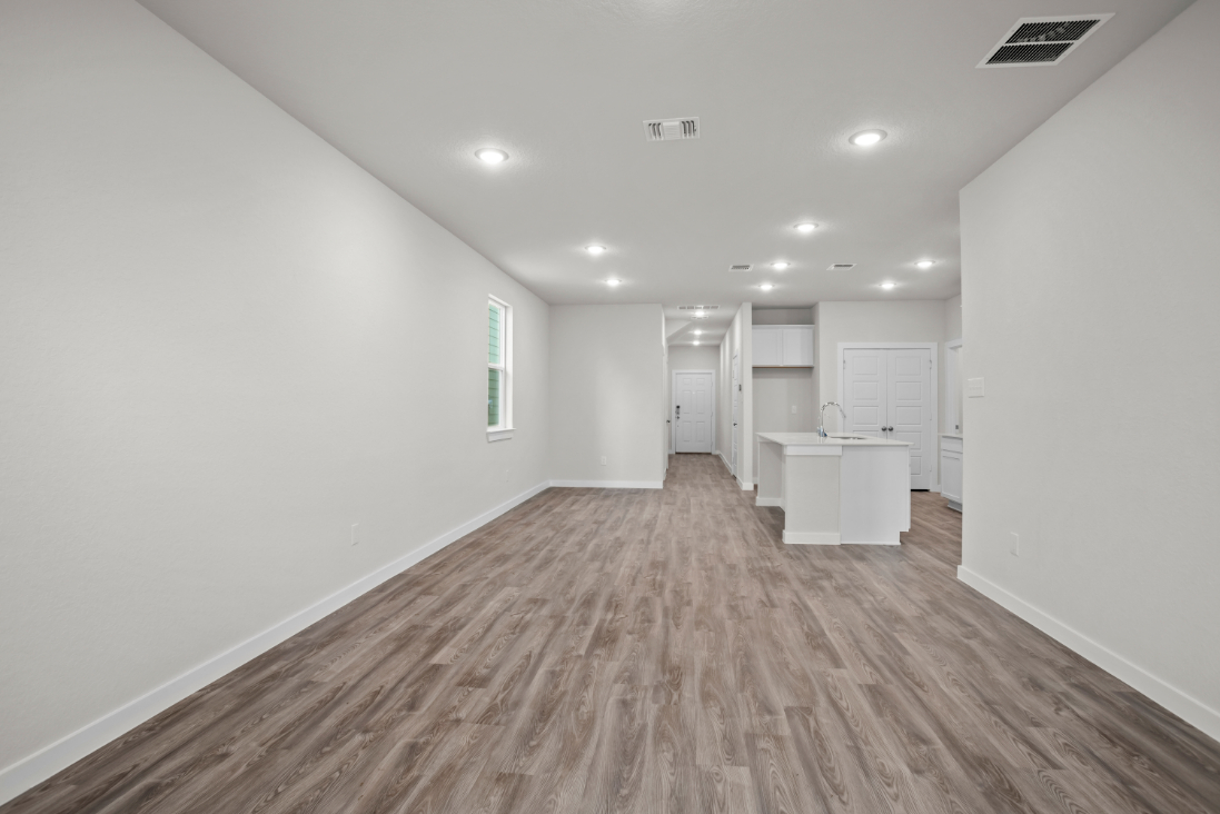 A long hallway with white walls.