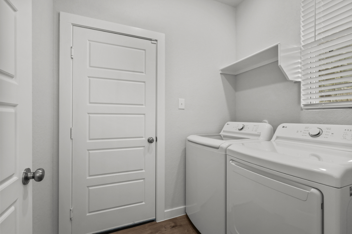 A white washer and dryer in a room.
