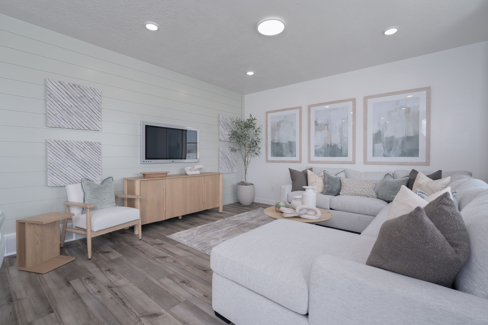 A living room with a couch and a tv.