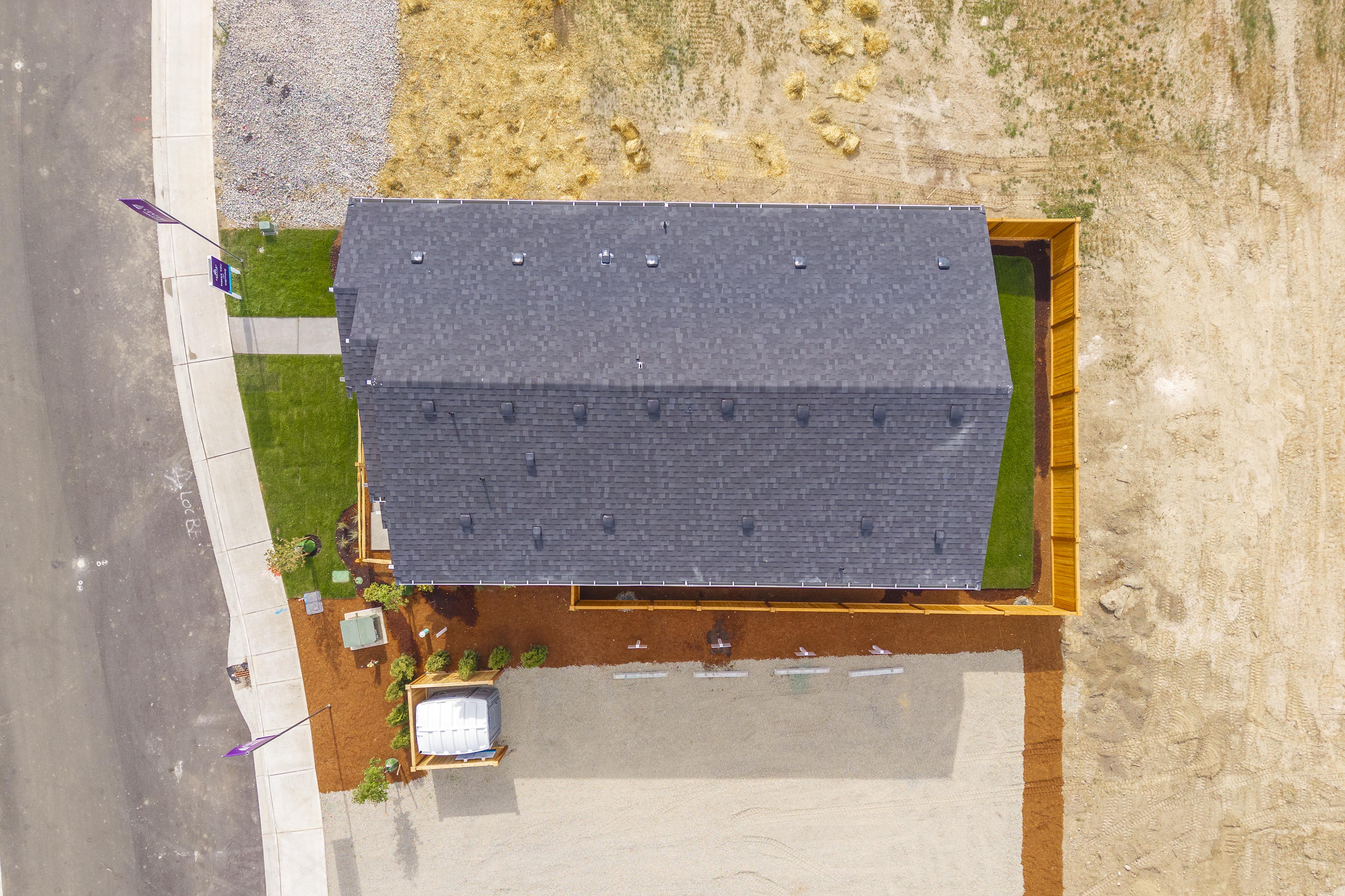 A small square building with a small pool in the middle.