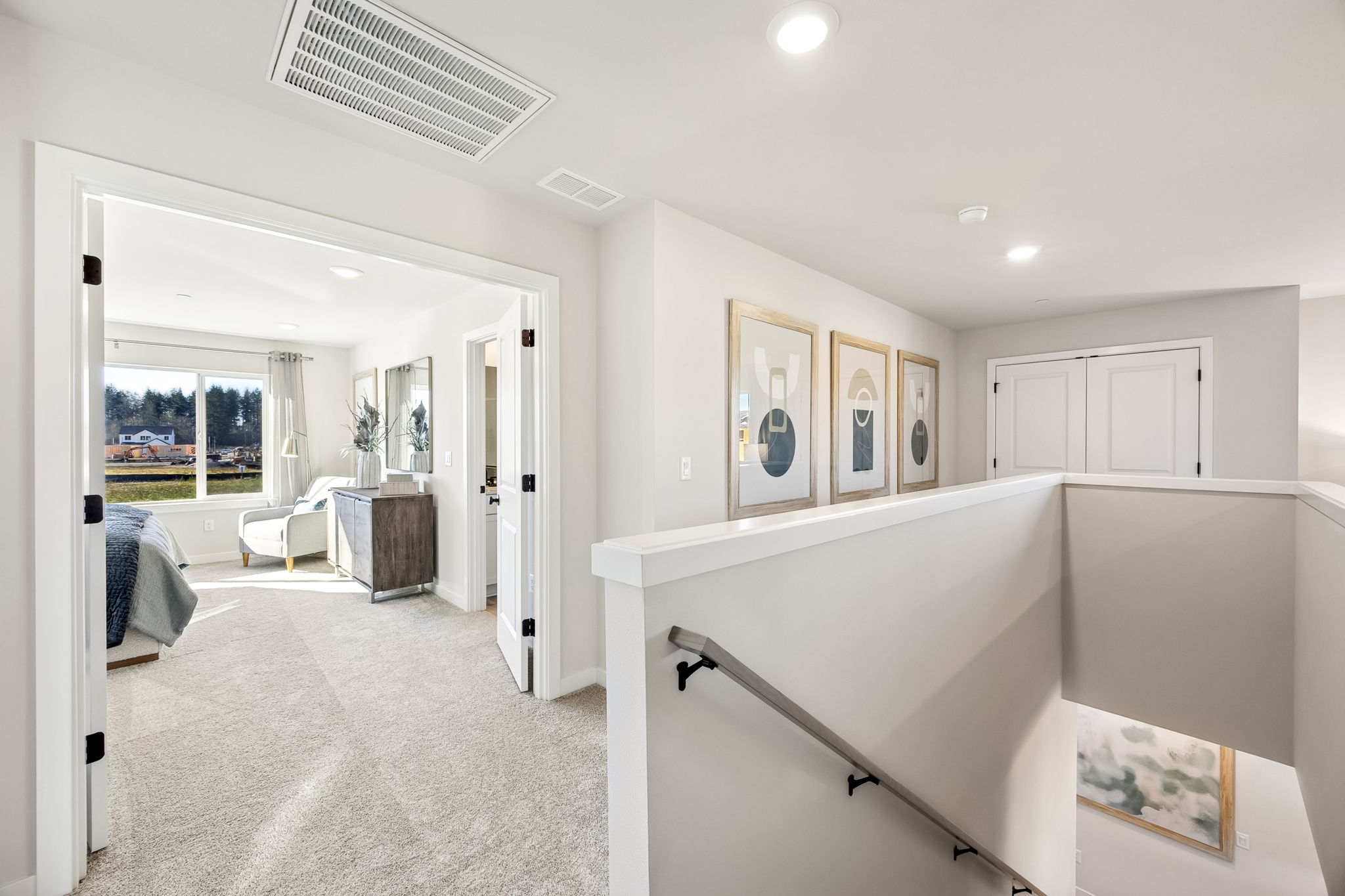 A room with white walls and a white counter with a white cabinet.
