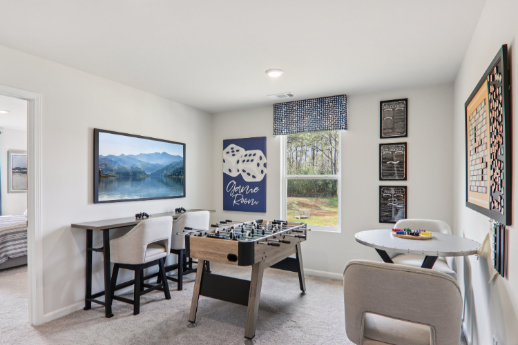 A room with a table and chairs.