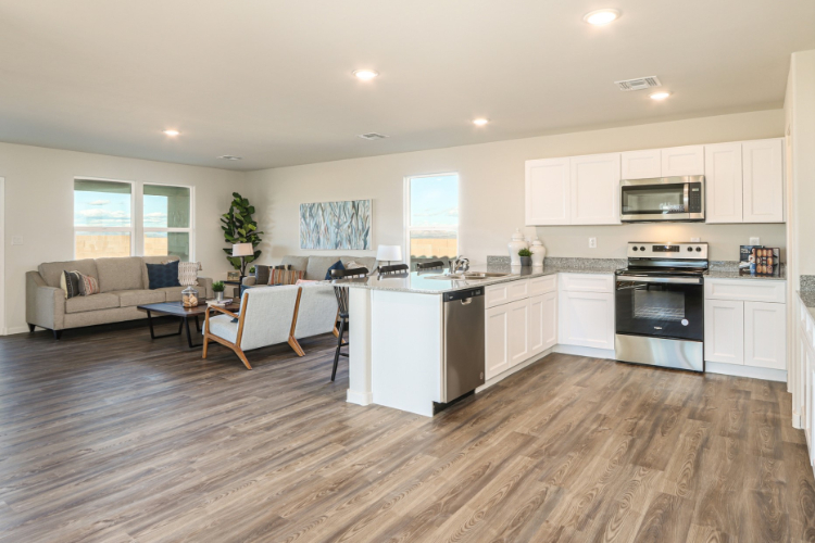 A large kitchen with white cabinets.
