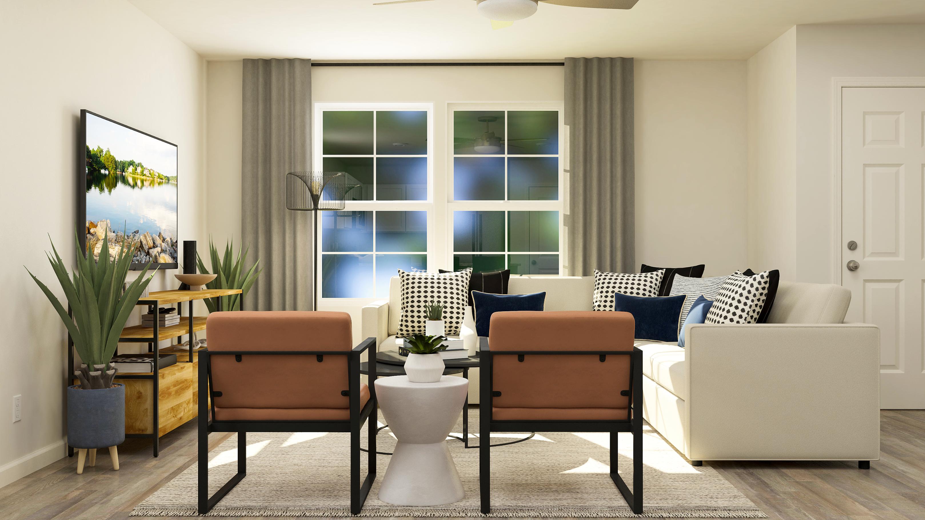 A living room with a couch and chairs.