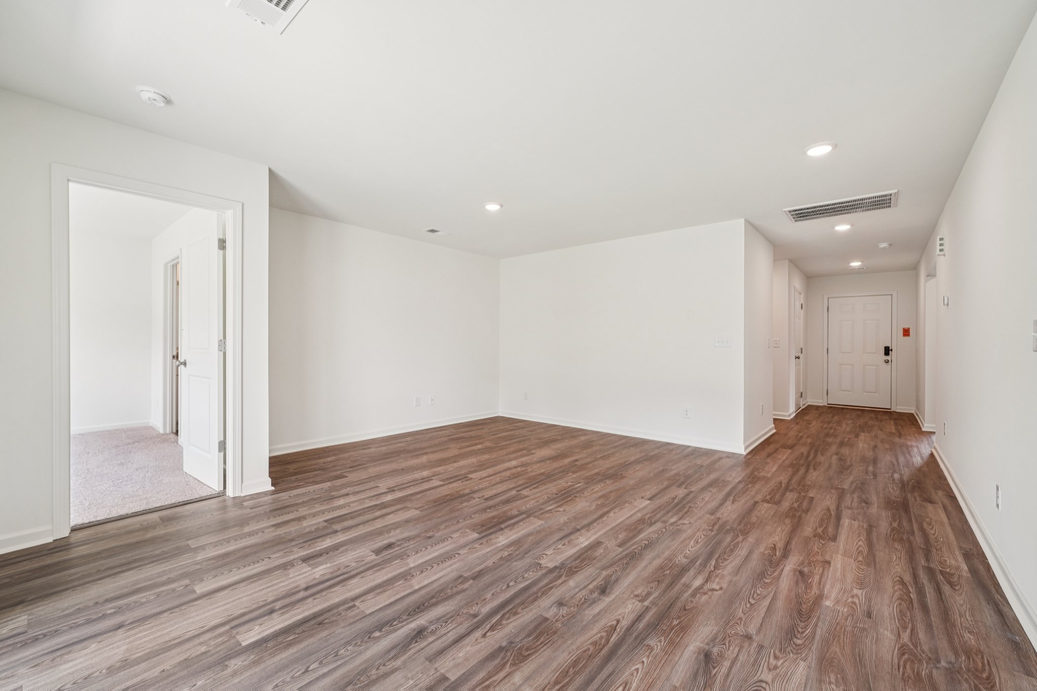 A room with wood floors.