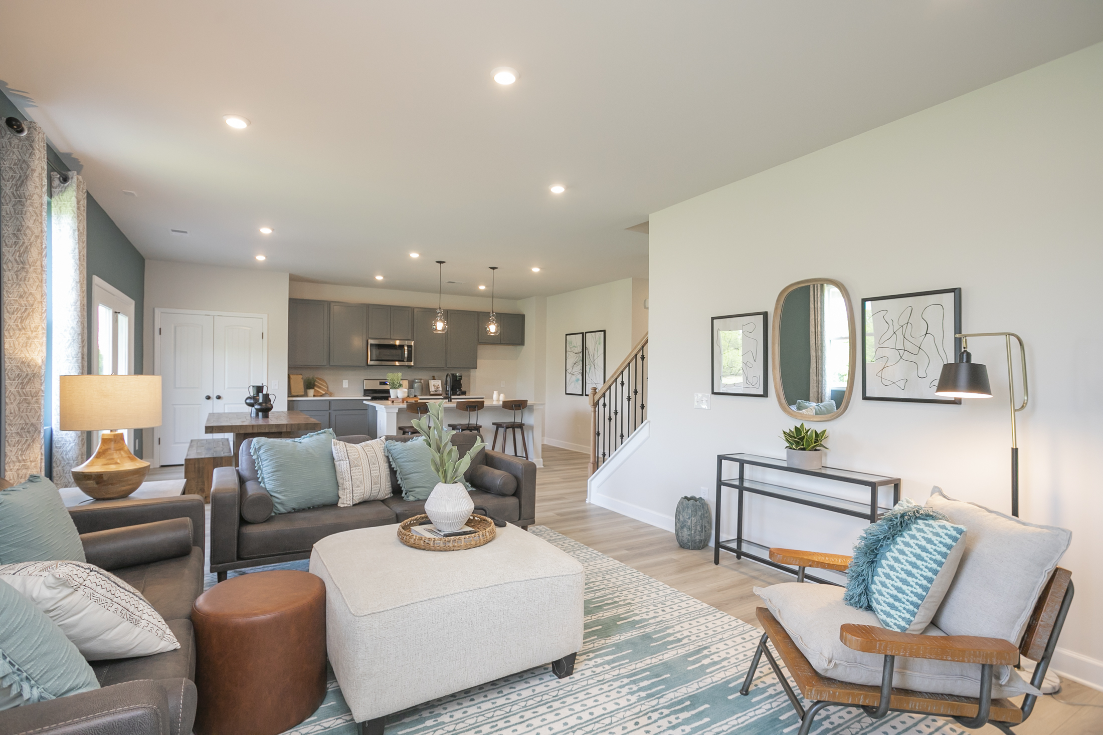 A living room with a couch and chairs.