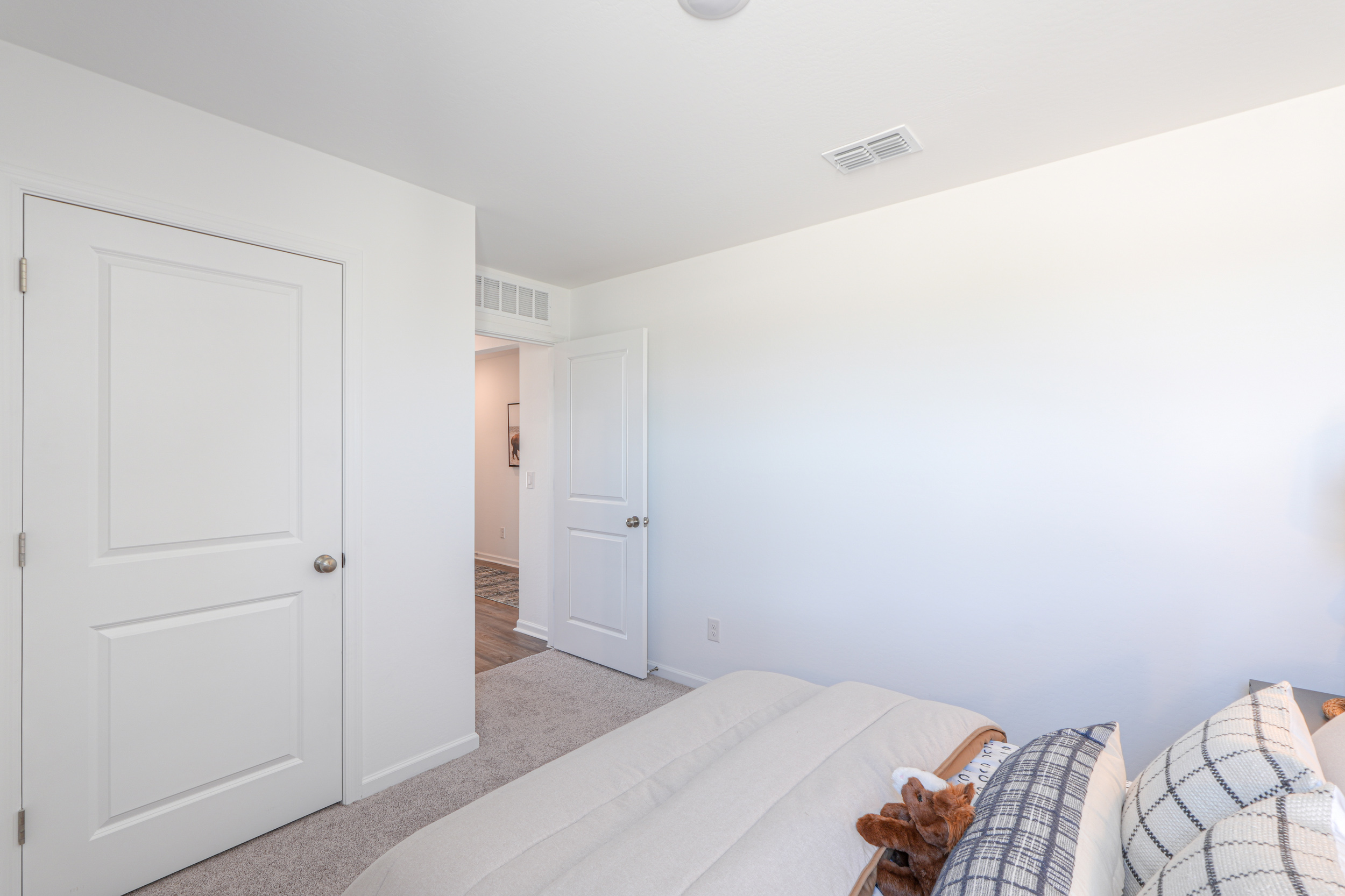 A room with white walls and a couch.