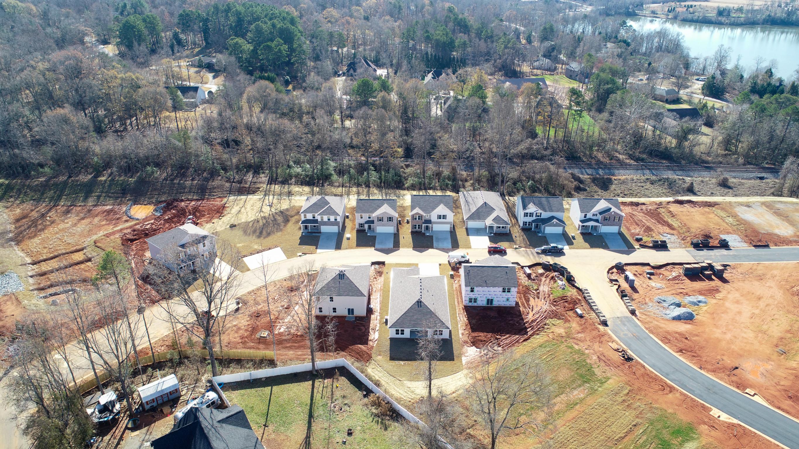 A group of houses in a wooded area.
