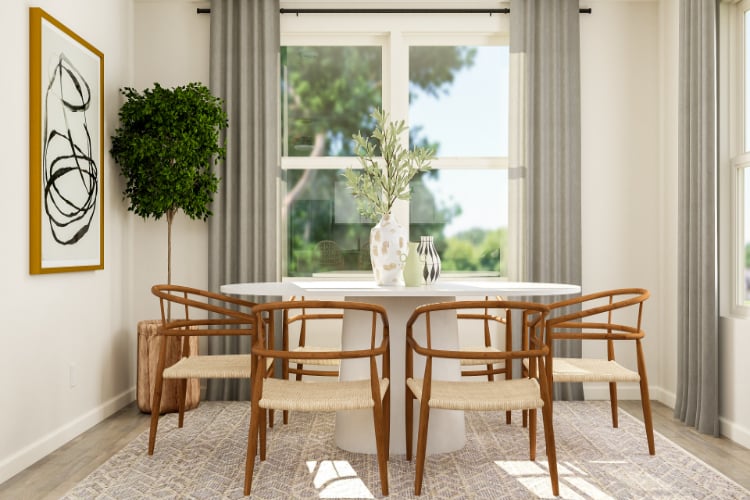 A dining table with chairs around it.